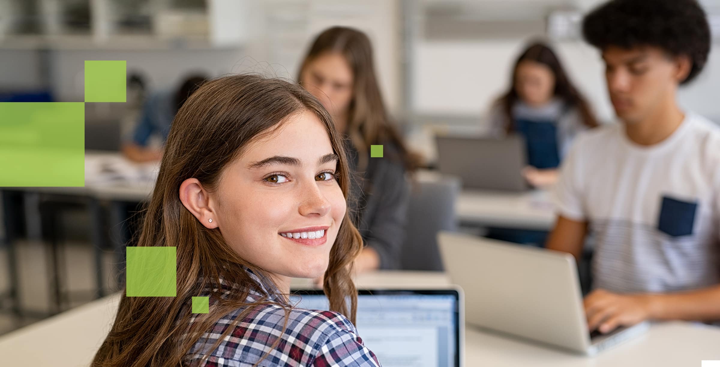 Happy student in college classroom.